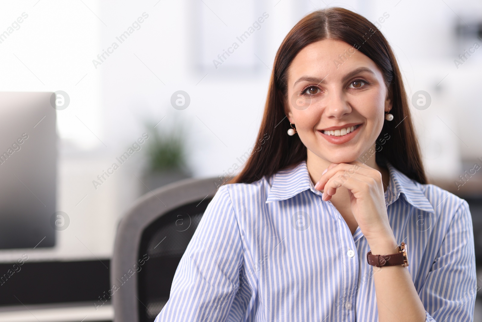 Photo of Portrait of happy banker in office, space for text