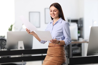 Photo of Portrait of banker with documents in office