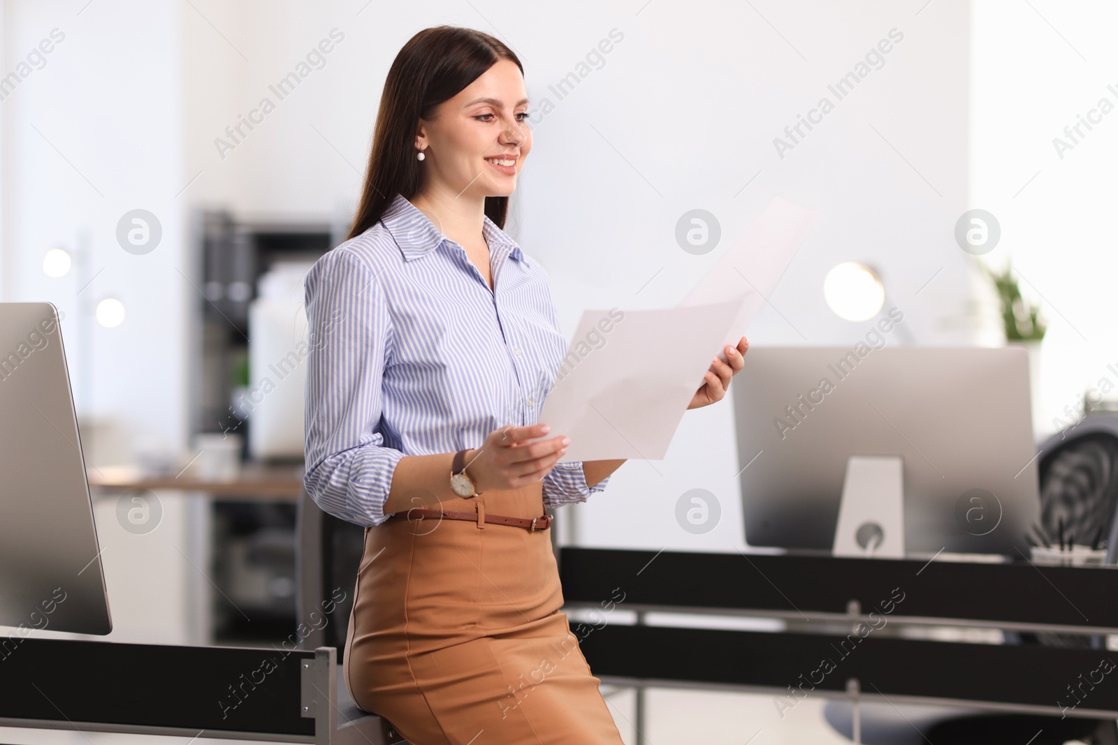 Photo of Portrait of banker with documents in office