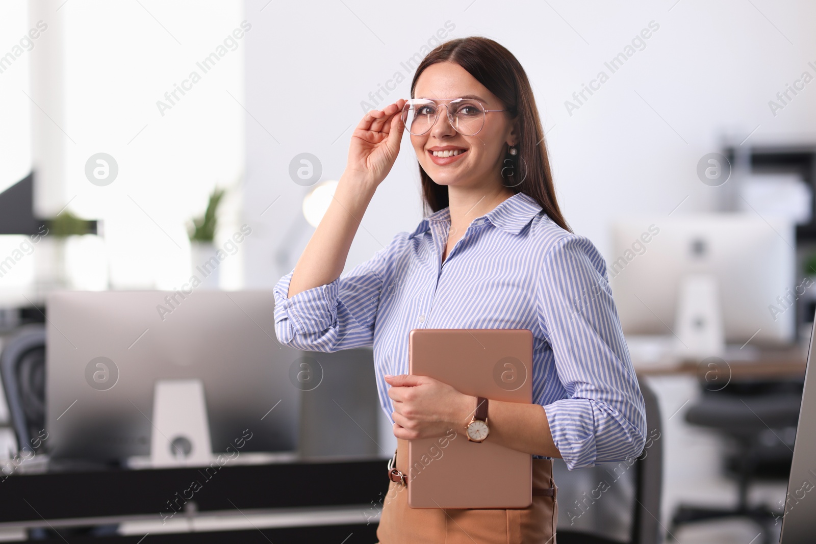 Photo of Portrait of banker using tablet in office, space for text