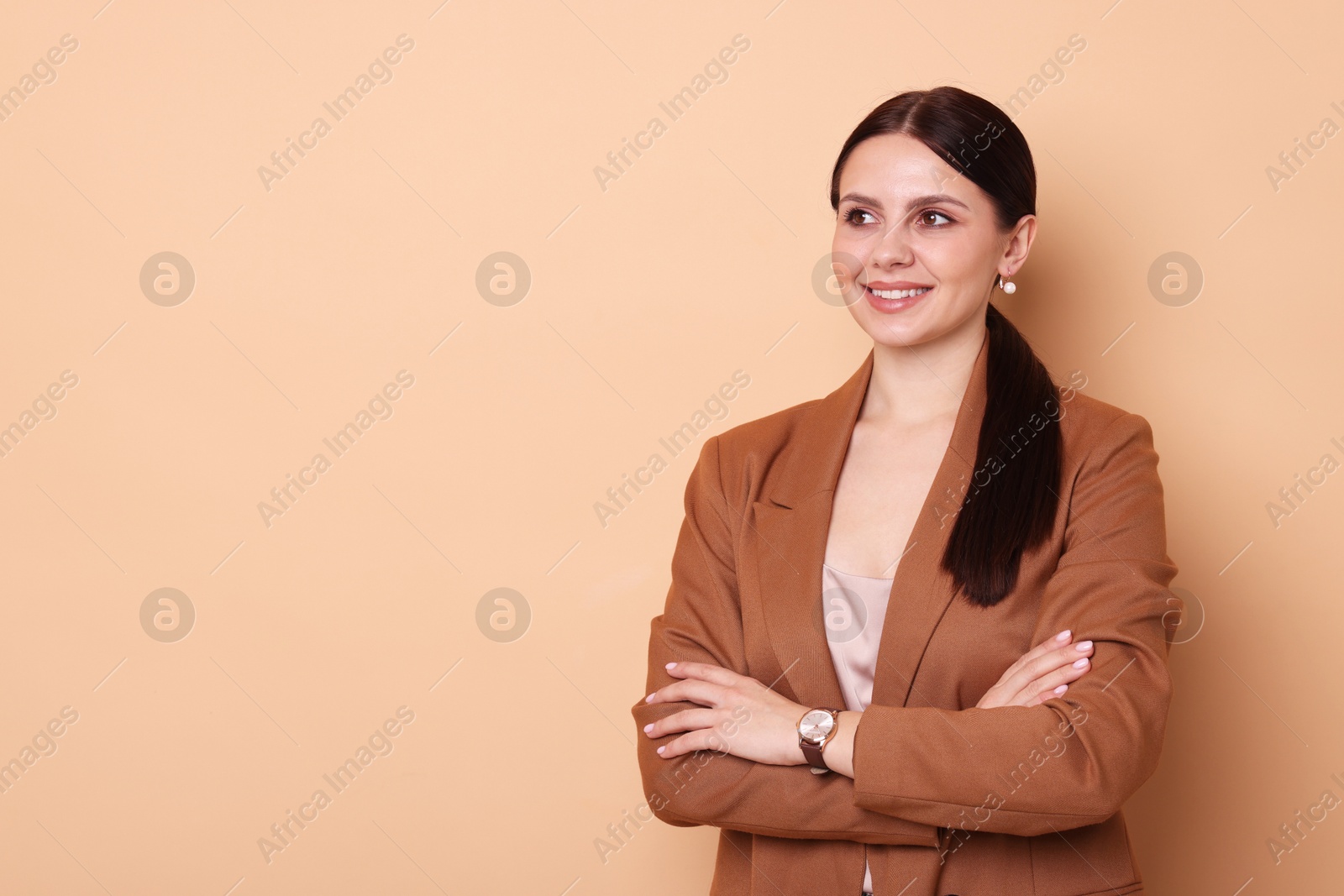 Photo of Portrait of banker with crossed arms on beige background, space for text