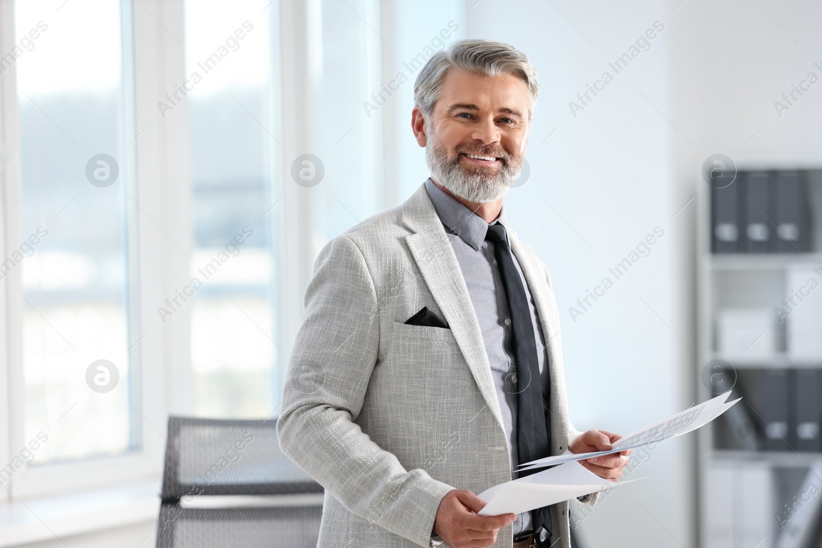 Photo of Banker with documents in office, space for text