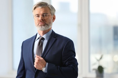 Photo of Portrait of banker in office, space for text