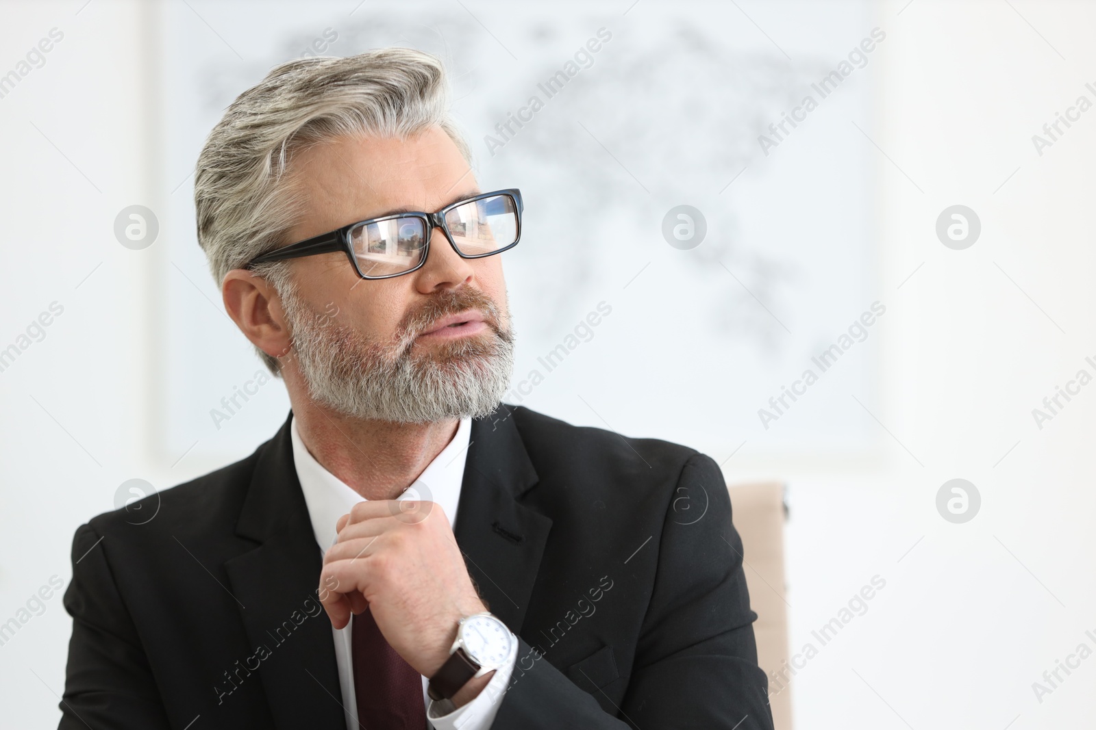 Photo of Portrait of banker with glasses in office, space for text