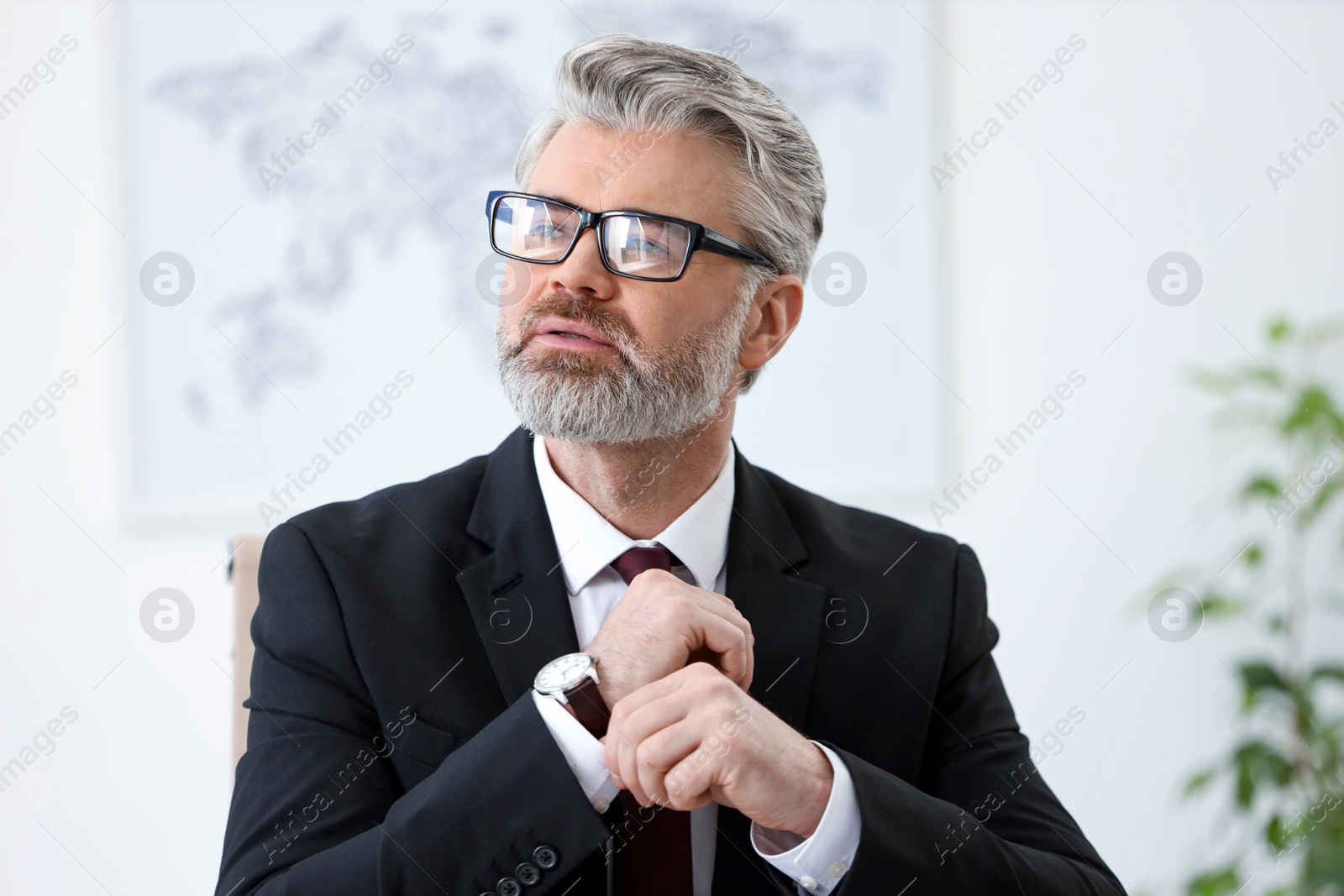 Photo of Portrait of banker with glasses in office