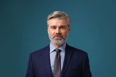 Photo of Confident banker in jacket on blue background