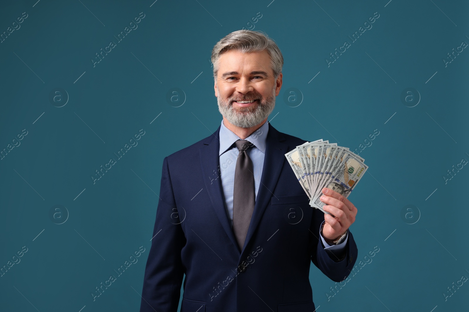 Photo of Banker with dollar banknotes on blue background