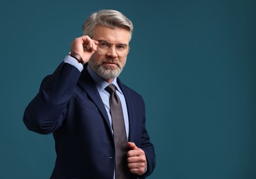 Photo of Banker in jacket on blue background, space for text