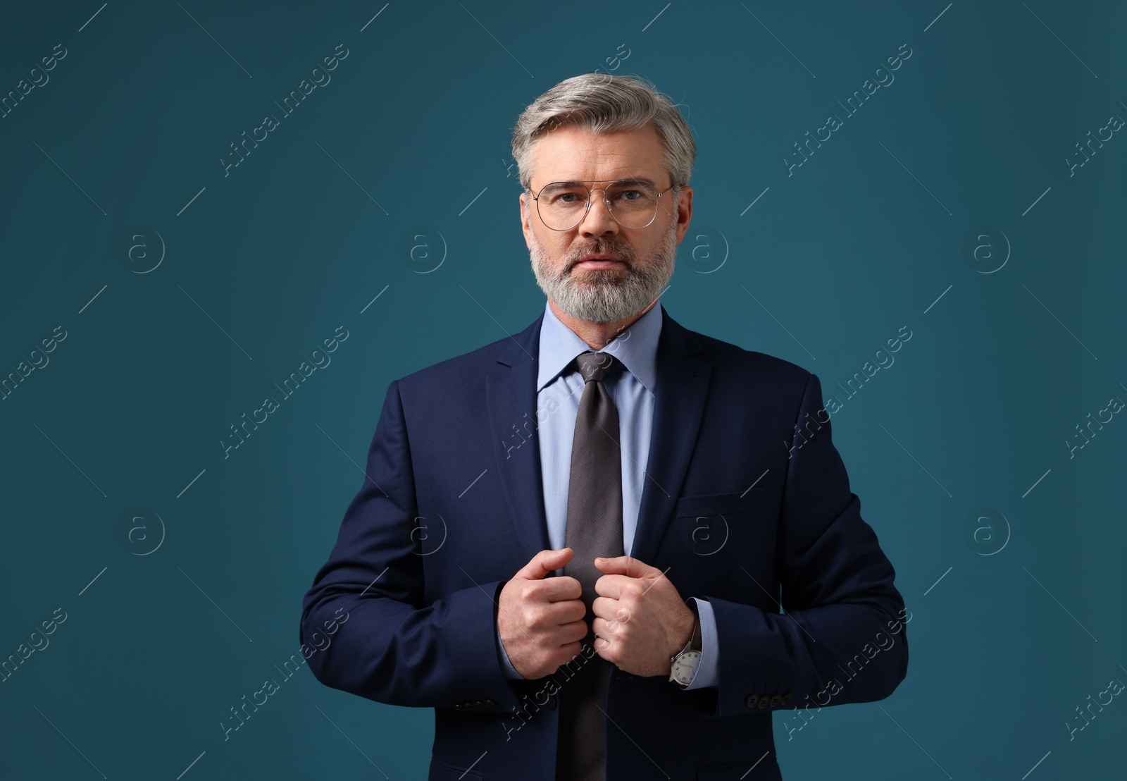 Photo of Confident banker in jacket on blue background