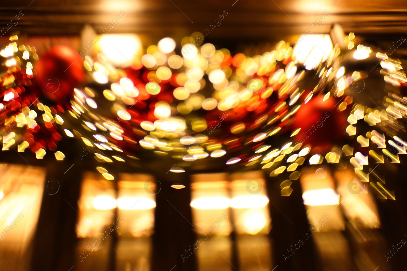 Photo of Defocused view of building with festive lights, motion blur and bokeh effect