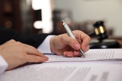 Photo of Judge working at table in office, closeup