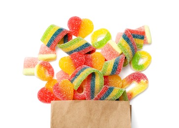 Paper bag with many different tasty candies isolated on white, top view