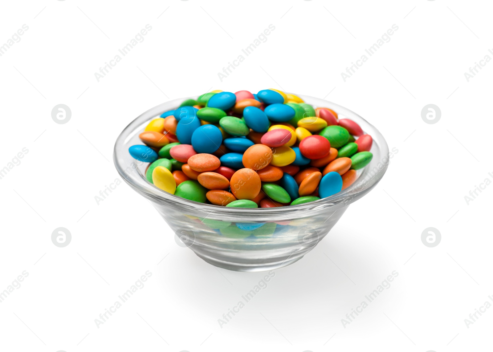 Photo of Many different tasty candies in bowl isolated on white