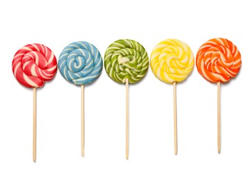 Photo of Tasty lollipops isolated on white, top view