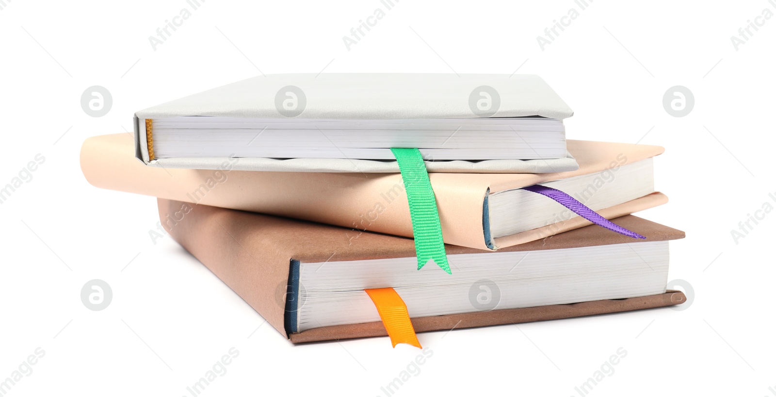 Photo of Books with ribbon bookmarks isolated on white