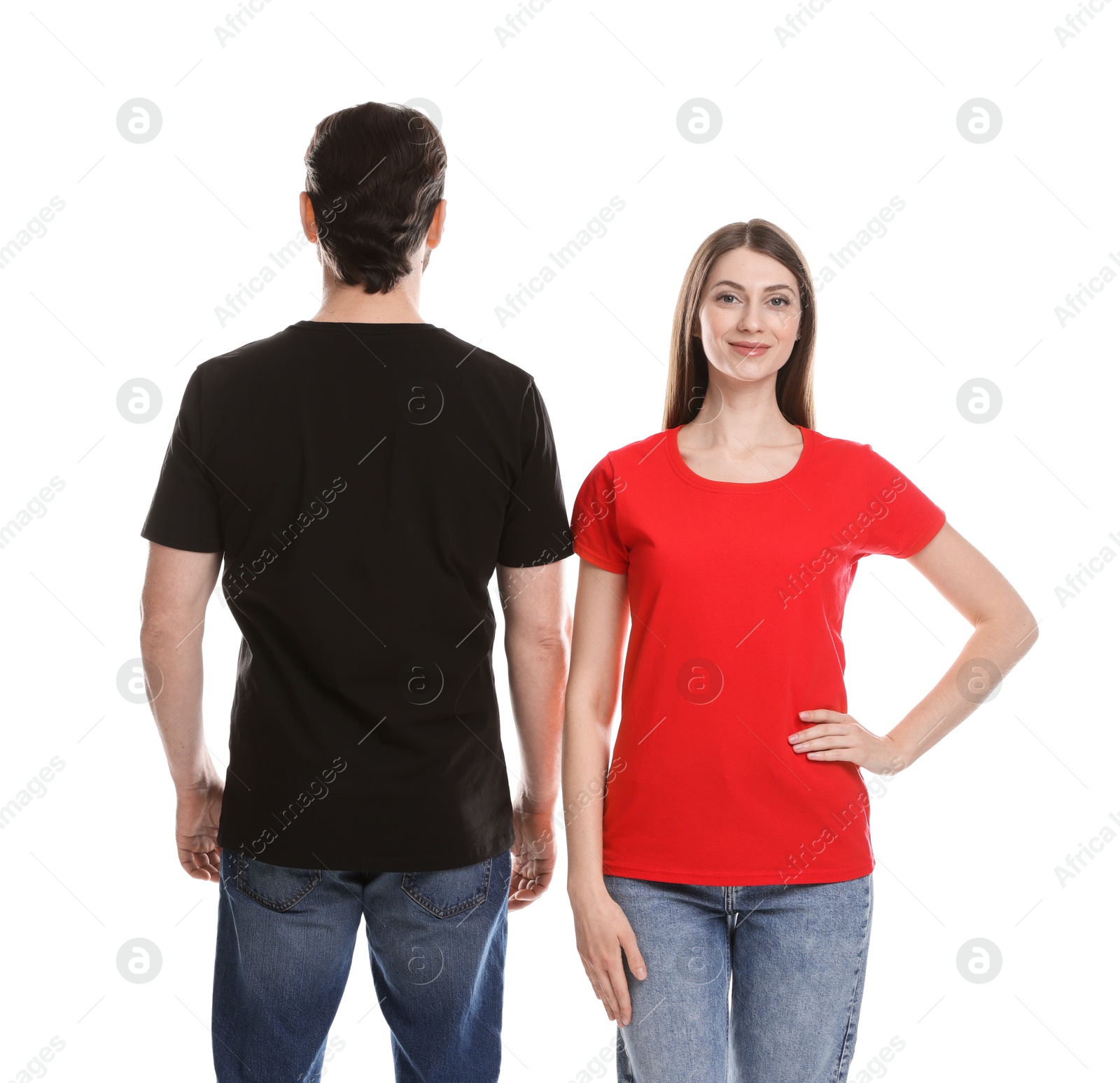 Photo of Woman and man wearing blank t-shirts on white background. Mockup for design