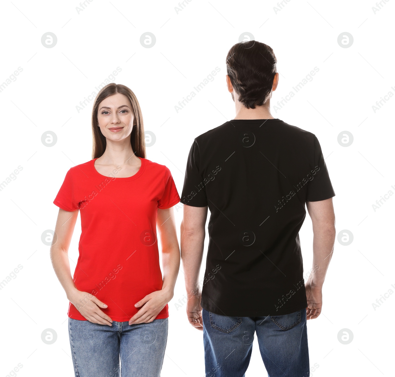 Photo of Woman and man wearing blank t-shirts on white background. Mockup for design