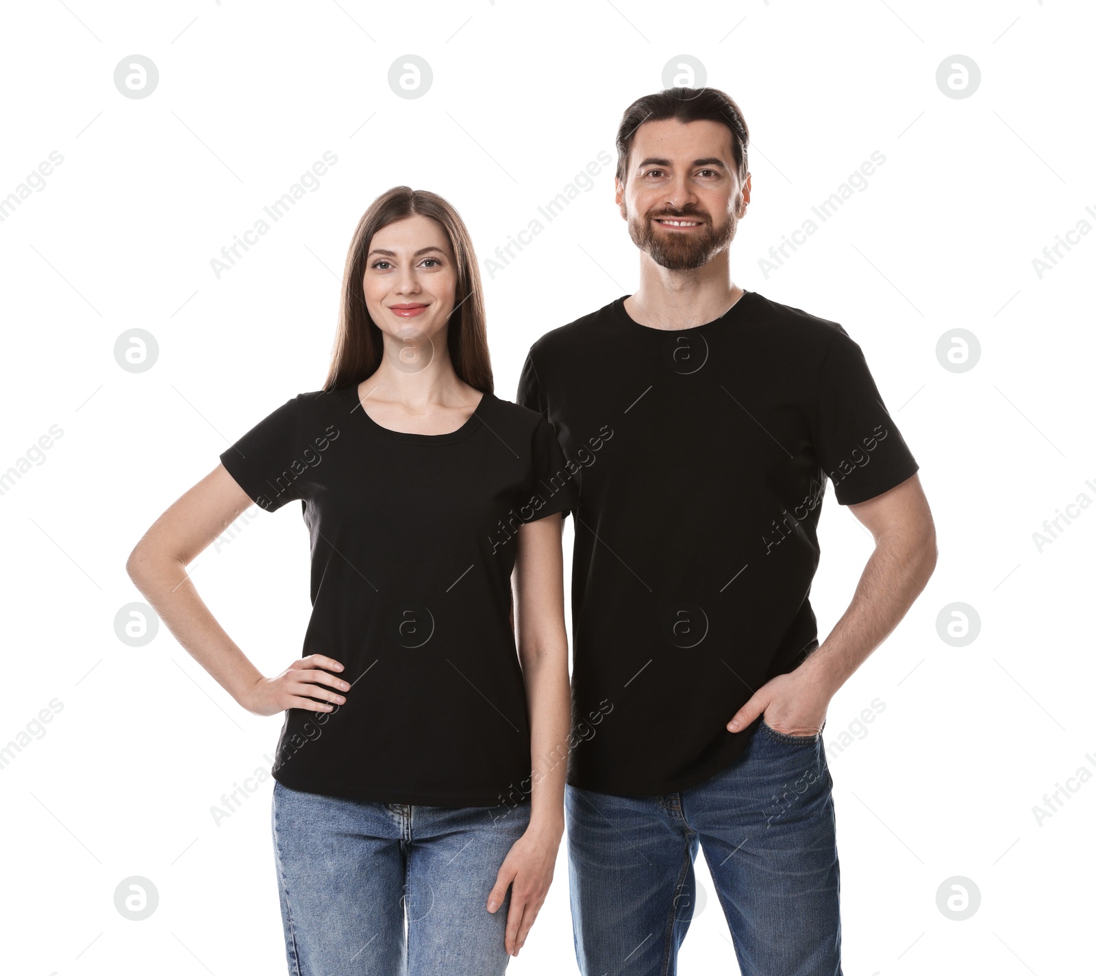 Photo of Woman and man wearing blank black t-shirts on white background. Mockup for design