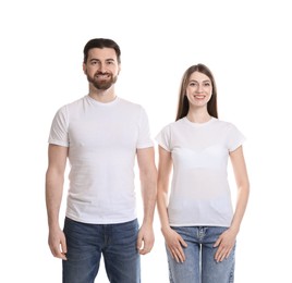 Photo of Woman and man wearing blank t-shirts on white background. Mockup for design