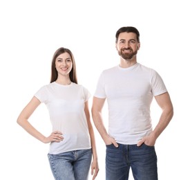 Photo of Woman and man wearing blank t-shirts on white background. Mockup for design