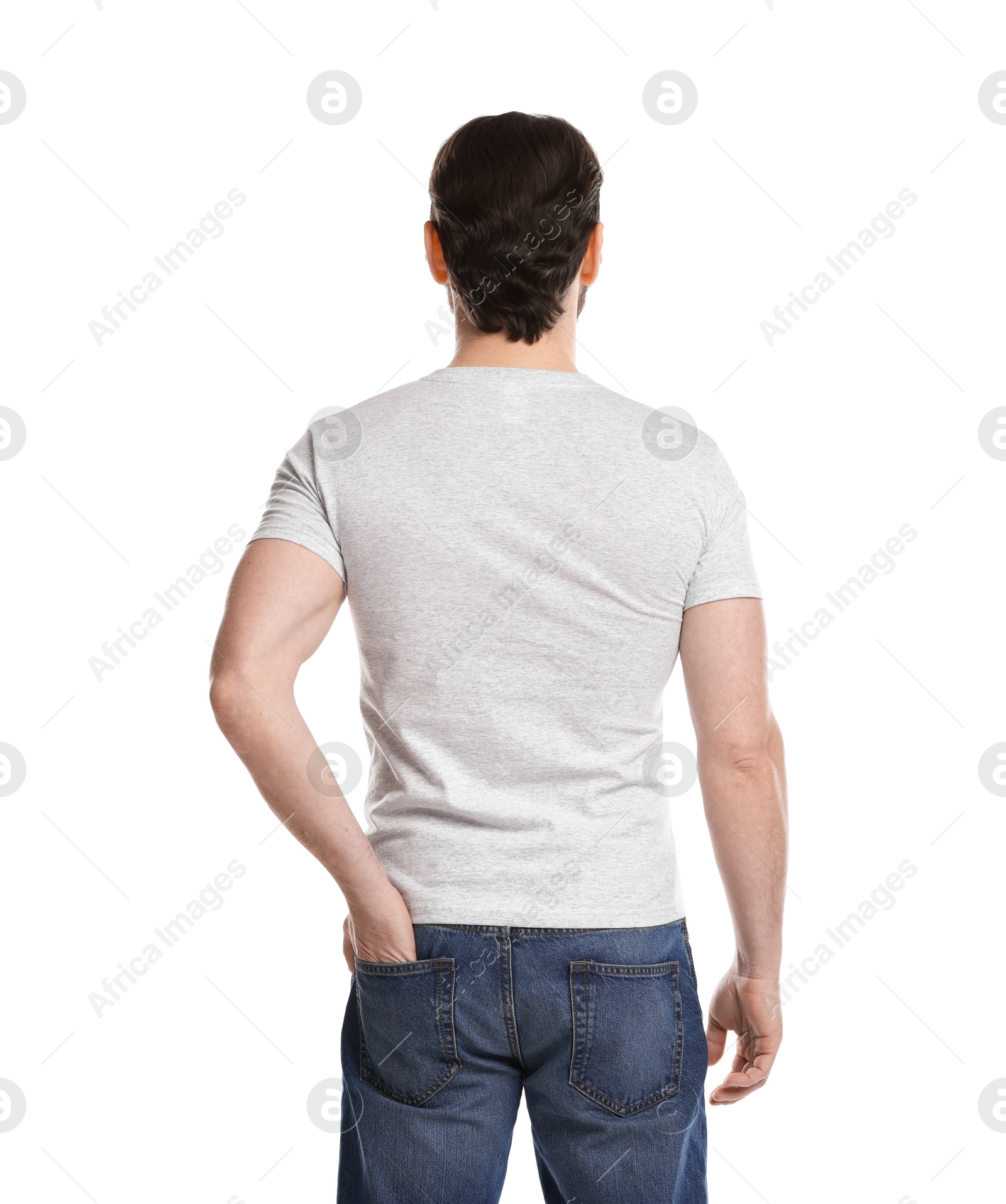 Photo of Man wearing blank t-shirt on white background, back view. Mockup for design