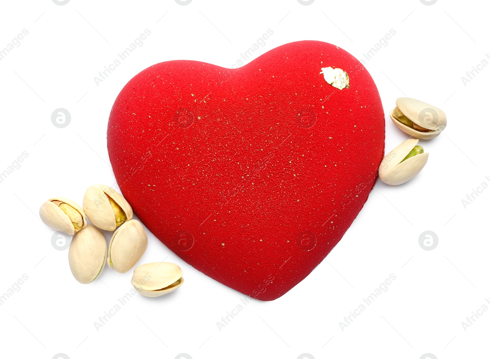 Photo of Heart shaped chocolate and pistachios isolated on white, top view