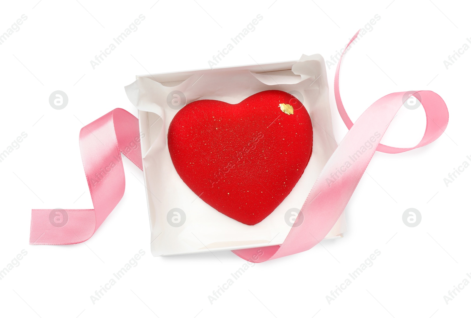 Photo of Heart shaped chocolate in box and pink ribbon isolated on white, top view