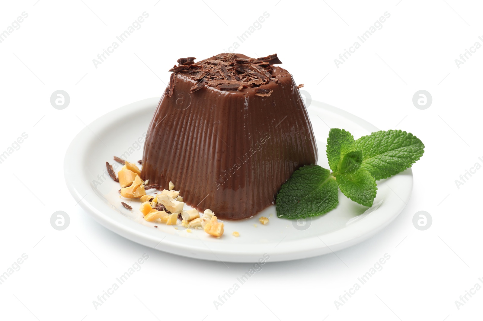 Photo of Tasty chocolate pudding with peanuts and mint isolated on white