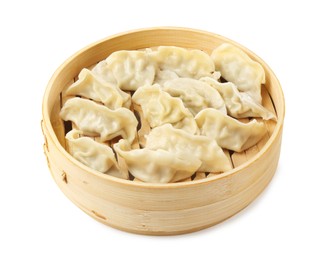 Photo of Tasty boiled gyoza (dumplings) in bamboo steamer on white background