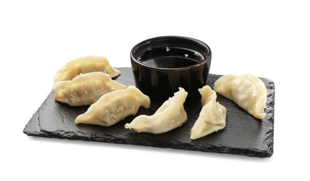 Photo of Tasty boiled gyoza (dumplings) with soy sauce on white background