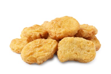 Photo of Many tasty chicken nuggets isolated on white