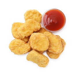 Photo of Tasty chicken nuggets with sauce isolated on white, top view