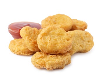 Photo of Tasty chicken nuggets with sauce isolated on white