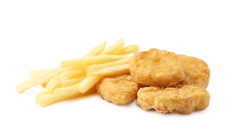 Photo of Tasty chicken nuggets and french fries isolated on white