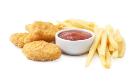 Photo of Tasty chicken nuggets and french fries with sauce isolated on white