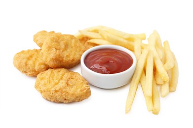 Photo of Tasty chicken nuggets and french fries with sauce isolated on white