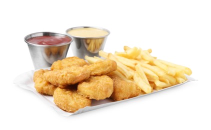 Photo of Tasty chicken nuggets and french fries with sauce isolated on white
