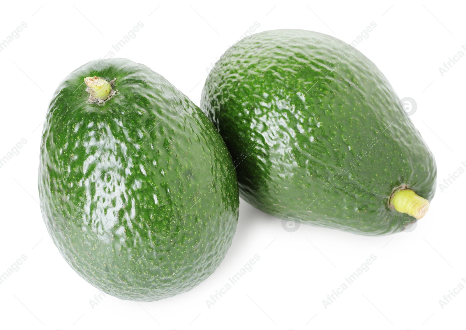 Photo of Two whole ripe avocados isolated on white