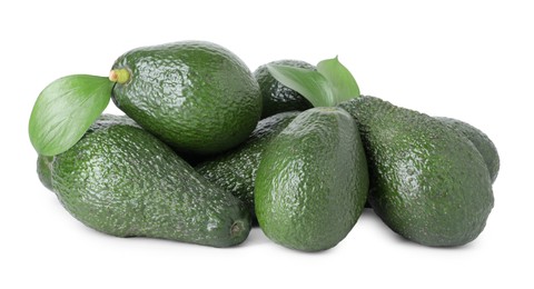 Photo of Pile of whole ripe avocados with green leaves isolated on white