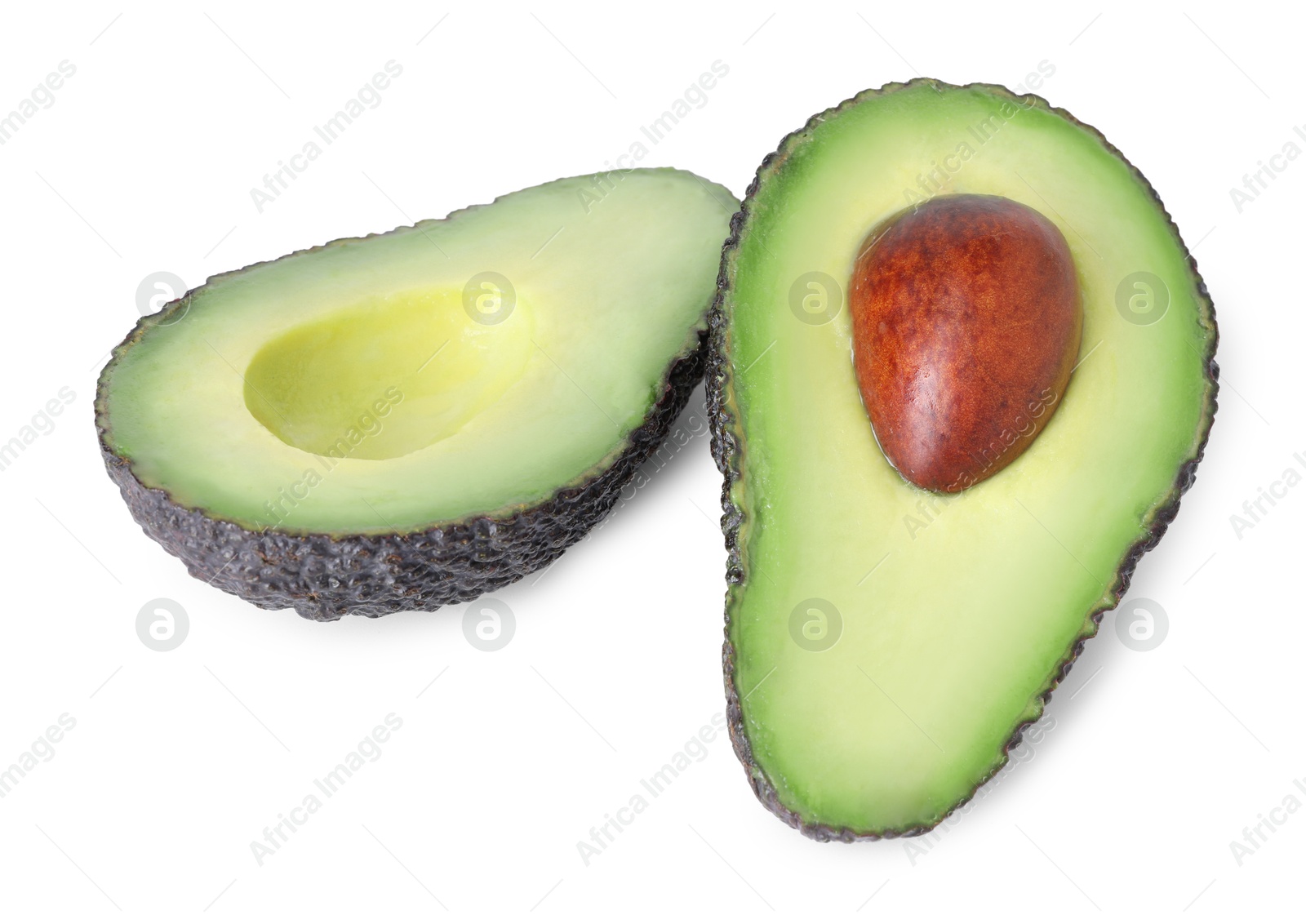 Photo of Halves of ripe avocado isolated on white