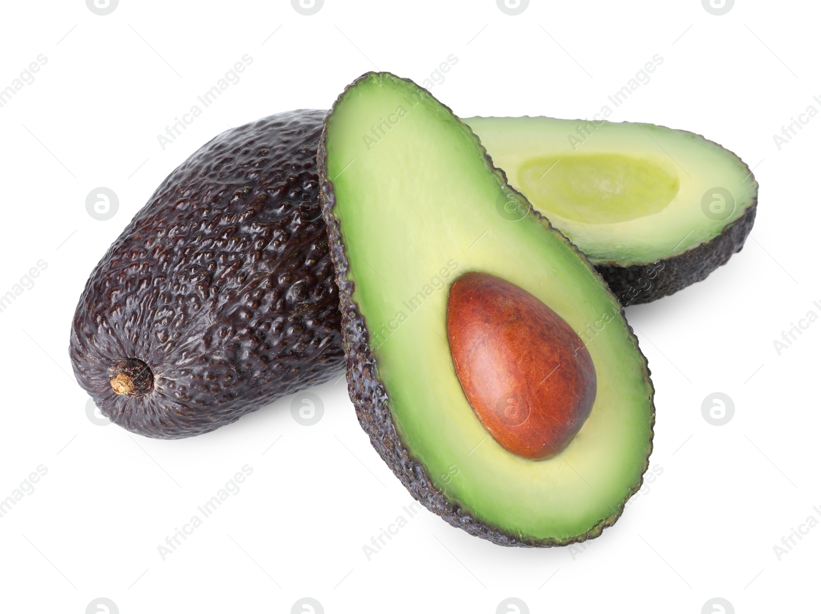 Photo of Whole and cut ripe avocados isolated on white