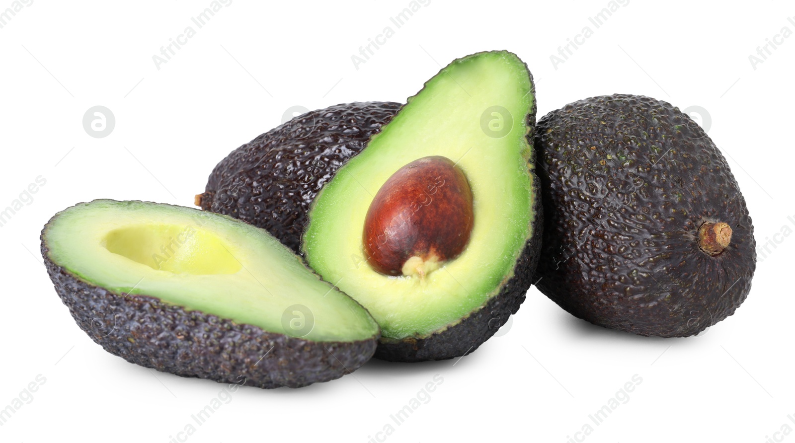 Photo of Whole and cut ripe avocados isolated on white