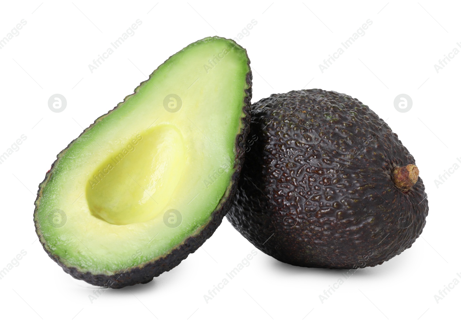 Photo of Whole and cut ripe avocados isolated on white