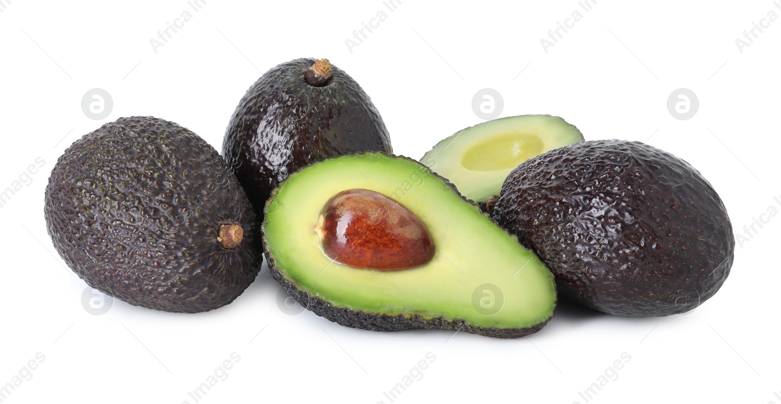 Photo of Whole and cut ripe avocados isolated on white