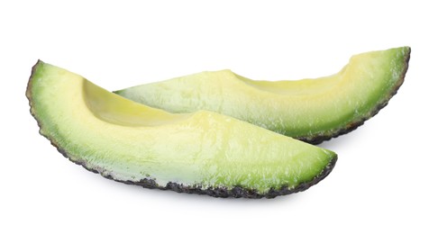 Photo of Slices of ripe avocado isolated on white