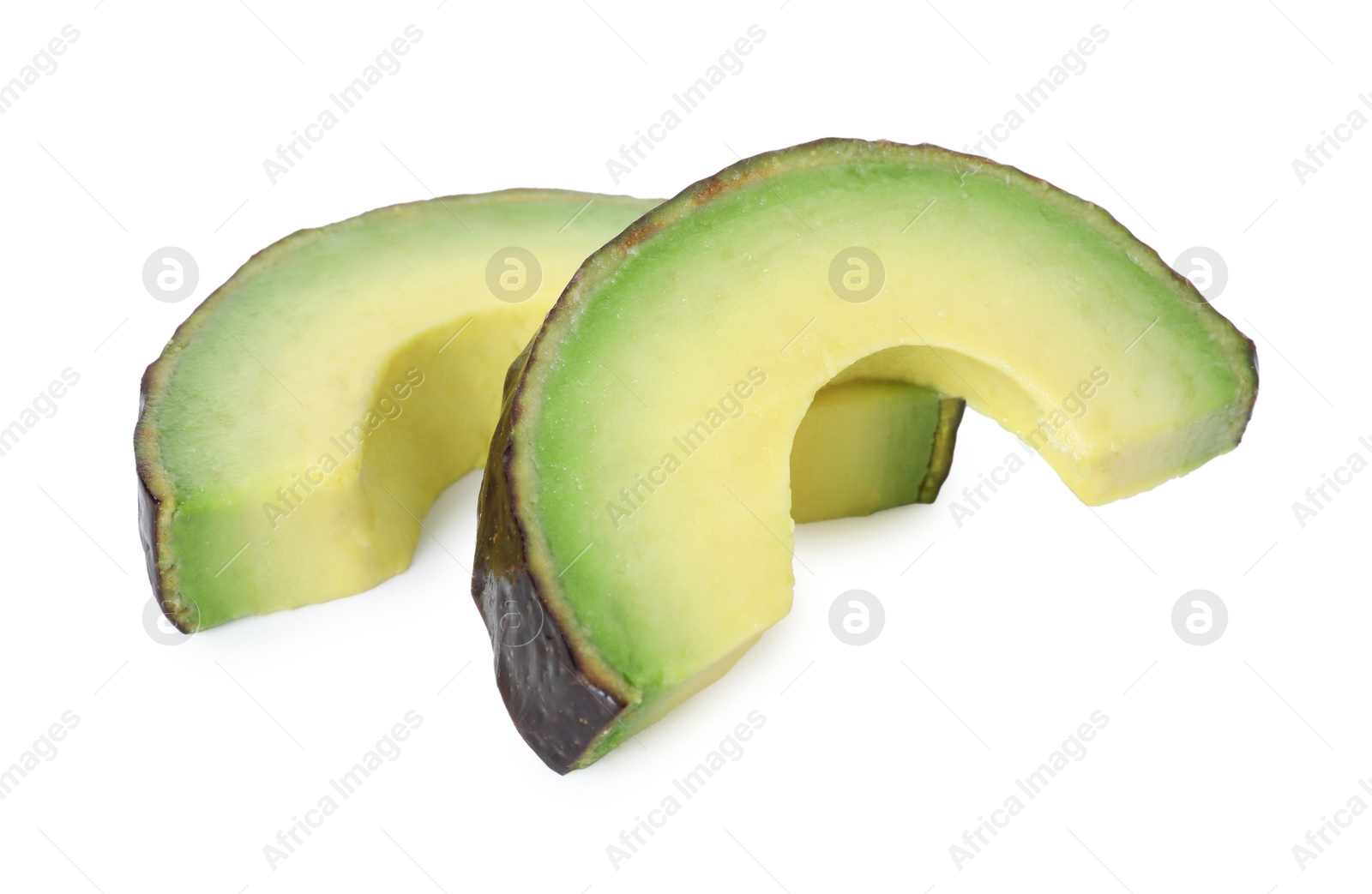 Photo of Slices of ripe avocado isolated on white