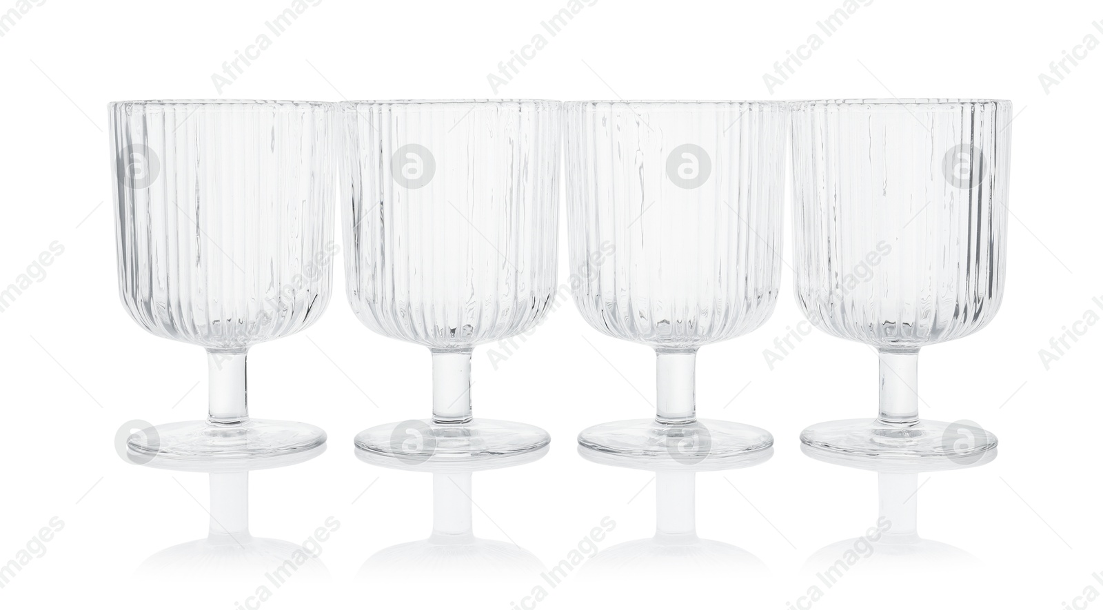 Photo of Many empty clean glasses isolated on white