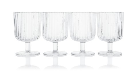 Photo of Many empty clean glasses isolated on white