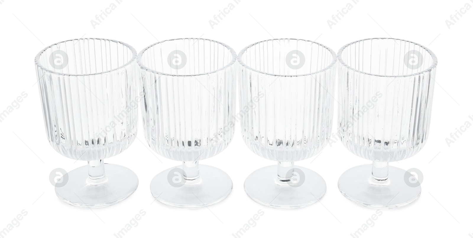 Photo of Many empty clean glasses isolated on white