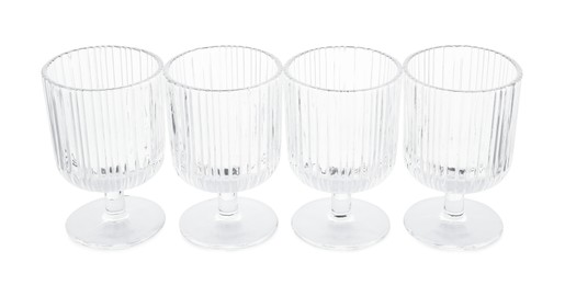 Photo of Many empty clean glasses isolated on white